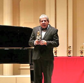 John receiving award at Carnegie Hall